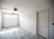 Thumbnail 13 of 21 - A room with a white door and a window with blinds.
