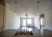 Thumbnail 15 of 21 - A kitchen with a sink and a window.