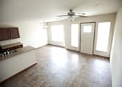 Thumbnail 7 of 15 - A kitchen with a fan on the ceiling and a tiled floor.