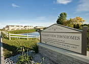 Thumbnail 1 of 15 - A sign for Pleasant View Townhomes with a phone number for renting.