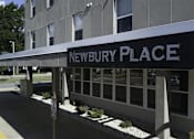 Thumbnail 10 of 22 - A building with a sign that says Newbury Place.