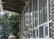Thumbnail 25 of 27 - A long row of windows on a building.