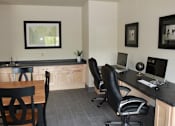 Thumbnail 6 of 18 - A room with a desk, chairs and a computer.