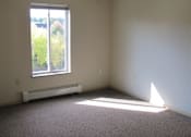Thumbnail 13 of 18 - A room with a ceiling fan and a window.
