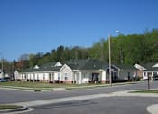 Thumbnail 11 of 11 - a row of houses on the side of a street