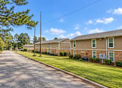 Thumbnail 4 of 11 - A long street with apartment buildings on both sides.
