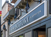 Thumbnail 23 of 25 - The Boston Hydration storefront is shown with a clear glass door and a sign above it.