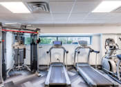 Thumbnail 7 of 20 - Fitness center with cardio and cable machine