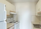 Thumbnail 2 of 23 - babcock tower apartment kitchen with range oven and fridge