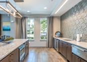 Thumbnail 17 of 28 - a kitchen with a large counter top and a window
