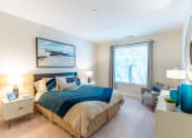 Thumbnail 4 of 28 - a bedroom with a large bed and a window