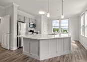 Thumbnail 1 of 35 - A kitchen with white cabinets and a wooden floor.