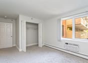 Thumbnail 7 of 28 - Kimball court renovated apartment bedroom with window and extra sunlight
