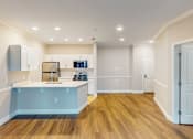 Thumbnail 13 of 26 - A kitchen with a sink and cabinets.