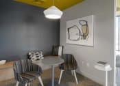 Thumbnail 15 of 25 - a dining room with a yellow ceiling and gray walls
