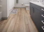 Thumbnail 8 of 25 - a bathroom with a toilet a sink and a mirror