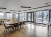 Thumbnail 17 of 25 - a large room with a long wooden table and chairs