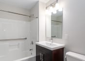 Thumbnail 20 of 20 - bathroom with bathtub and bright vanity and luxury fittings
