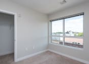 Thumbnail 16 of 20 - apartment bedroom and large closet and window, carpet floor