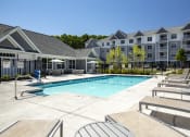Thumbnail 12 of 28 - Lounge on the pool deck overlooking pool