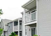 Thumbnail 16 of 16 - a white house with a porch and a balcony at Blue Hills Village, Canton, Massachusetts