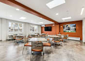 Thumbnail 10 of 17 - A conference room with a long table and chairs.