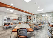 Thumbnail 14 of 17 - A modern dining room with a long table and chairs.
