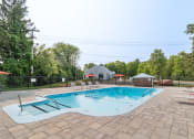 Thumbnail 3 of 14 - Outdoor swimming pool at Mansfield Meadows Apartments in Mansfield, MA.