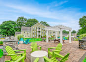 Thumbnail 17 of 19 - Resident Outdoor patio with BBQ  and a Pergola at Station Pointe, Mansfield, 02048