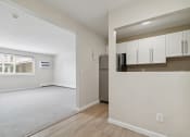 Thumbnail 7 of 14 - Kitchen and Living Room Apartment Interior at Mansfield Meadows Apartments.