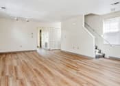 Thumbnail 4 of 14 - an empty living room with a hard wood floor and white walls at Monterey Place, New Haven, 06511
