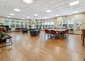 Thumbnail 12 of 14 - a large room with a table and chairs in the center of it  at Monterey Place, New Haven