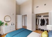 Thumbnail 7 of 16 - a bedroom with a bed and a closet at Beverly Village for Living & the Arts Apartments, Massachusetts