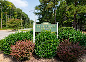 Thumbnail 7 of 12 - Property entrance sign with landscaping at Blue Ridge Estates Apartments, Richmond
