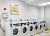 Thumbnail 7 of 17 - A row of washing machines numbered 13, 14, and 15 at Edmands House, Framingham, 01701