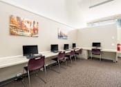 Thumbnail 3 of 12 - Computer lab with workstations and seating at Blue Ridge Estates Apartments, Richmond, VA 23225