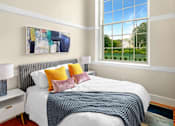 Thumbnail 6 of 16 - a bedroom with a bed and a large window at Beverly Village for Living & the Arts Apartments, Beverly, 01915