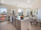 Thumbnail 1 of 6 - Modern Kitchens With Ample Storage and a view of the city at Pok Oi Residences, Boston, MA, Massachusetts