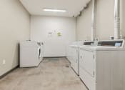 Thumbnail 13 of 13 - a laundry room with washers and dryers at The Carina, Pittsburgh, PA