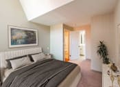 Thumbnail 2 of 18 - a bedroom with a bed and a painting on the wallat Royal Worcester Apartments, Worcester, 01610