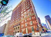 Thumbnail 13 of 14 - a tall brick building on the corner of a city street  at 140 Clarendon, Boston, MA, 02116
