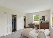 Thumbnail 7 of 16 - a bedroom with a bed and a closet with a dresser and a mirror at Blue Hills Village, Canton, Massachusetts