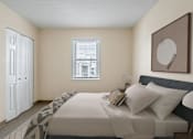 Thumbnail 5 of 16 - A bedroom with a bed at Blue Hills Village, Canton, MA.