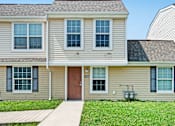 Thumbnail 3 of 3 - a house with a green lawn and a blue sky in the background  at Cornerstone Townhomes, New York, 14305