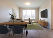 Thumbnail 2 of 12 - A modern dining room with a wooden table and chairs  at 35 Broadway Apartments, Menands, New York