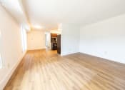 Thumbnail 6 of 9 - Apartment Living Room with Hardwood Floors at The Belt Atlantic Apartments, Richmond, Virginia