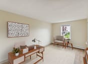 Thumbnail 3 of 16 - a living room with a desk and a chair and a window at Blue Hills Village, Canton, MA