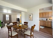 Thumbnail 2 of 16 - Kitchen With Updated Cabinets and Flooring With Adjacent Dining Room at Georgetowne Homes Apartments, Massachusetts