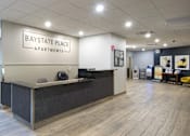 Thumbnail 11 of 15 - Apartment leasing office reception area at Baystate Place Apartments, Massachusetts, 1104