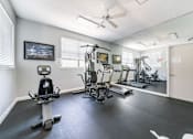 Thumbnail 9 of 14 - A spacious home gym with a variety of exercise equipment Fishermans Landing Apartments in Ormond Beach, FL.